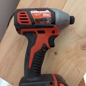 Milwaukee Red and Black Impact Driver
